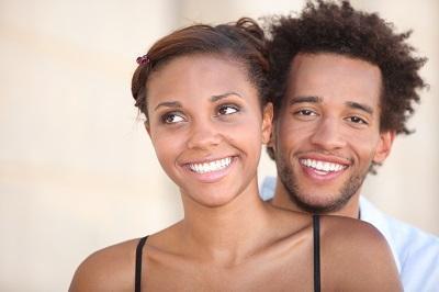 man and woman smiling