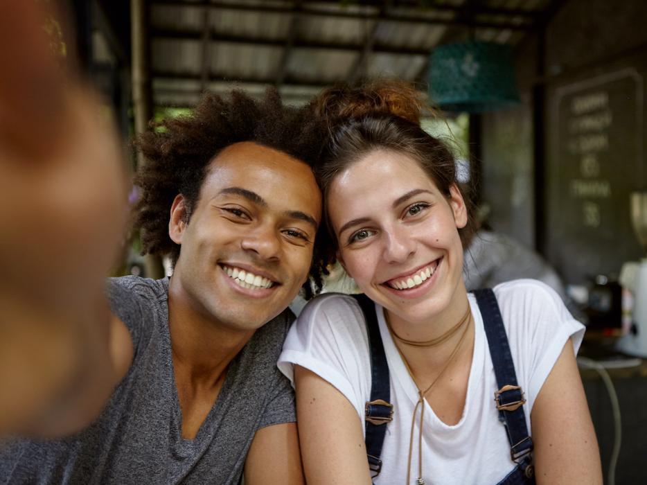 Man and woman smiling in a selfie