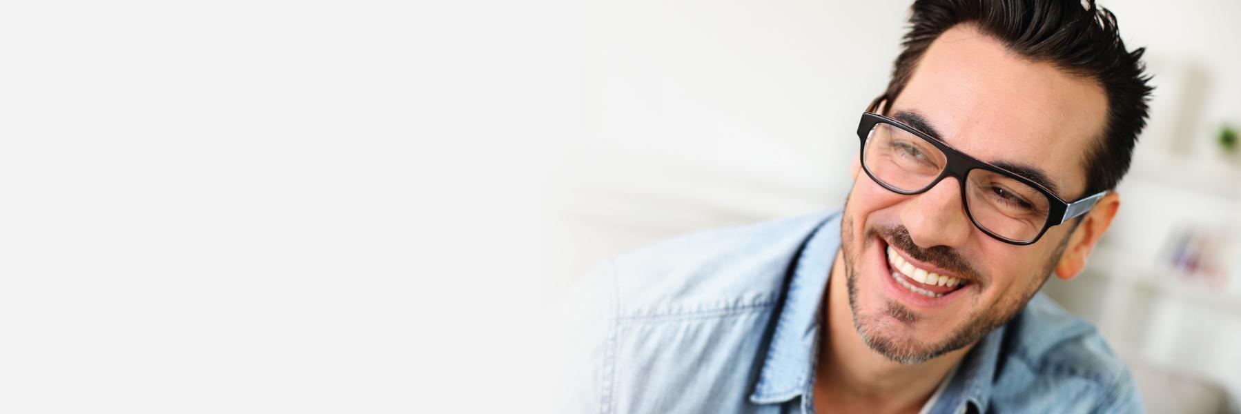 man smiling after using invisalign