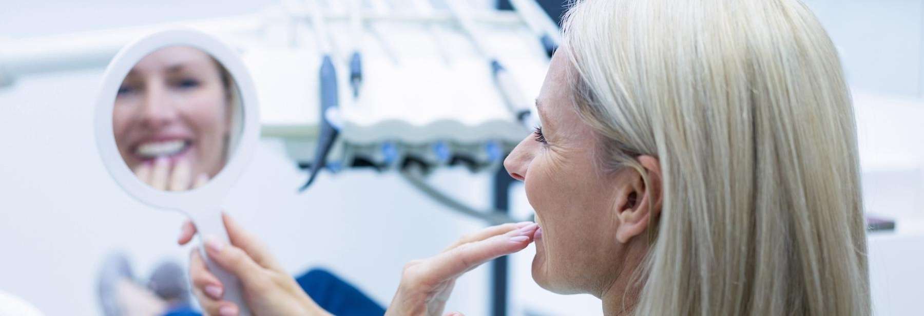 cosmetic dentistry procedures | woman at dentist