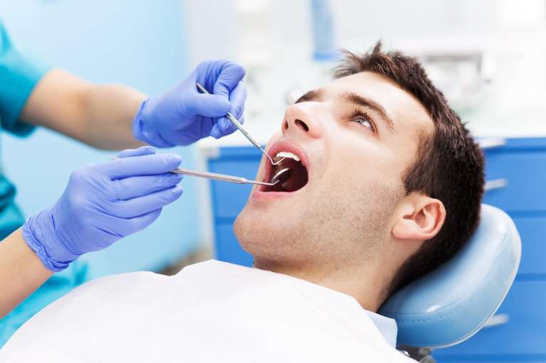 patient receiving dental cleaning in Phoenix