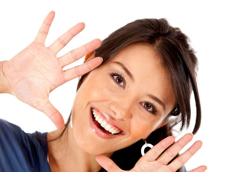 smiling woman after dental bridge consultation in Phoenix