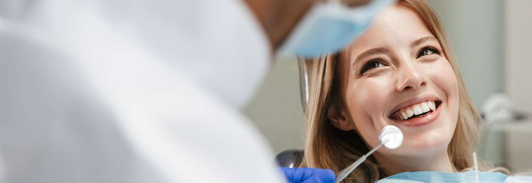 A smiling girl undergoing dental check up in Phoenix
