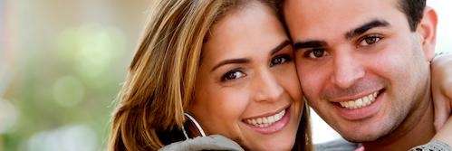 man and woman smiling