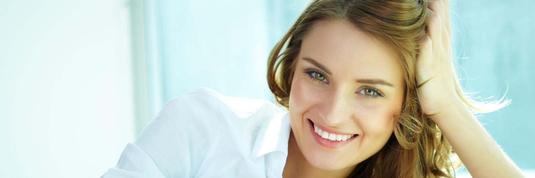 Woman smiling after full smile reconstruction in 85251