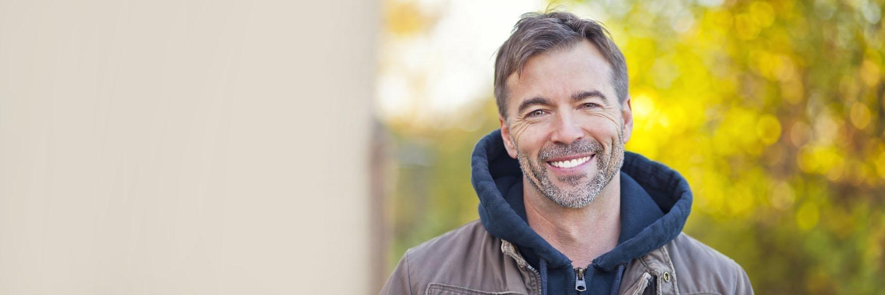 Man smiling after relieving TMJ pain in Phoenix