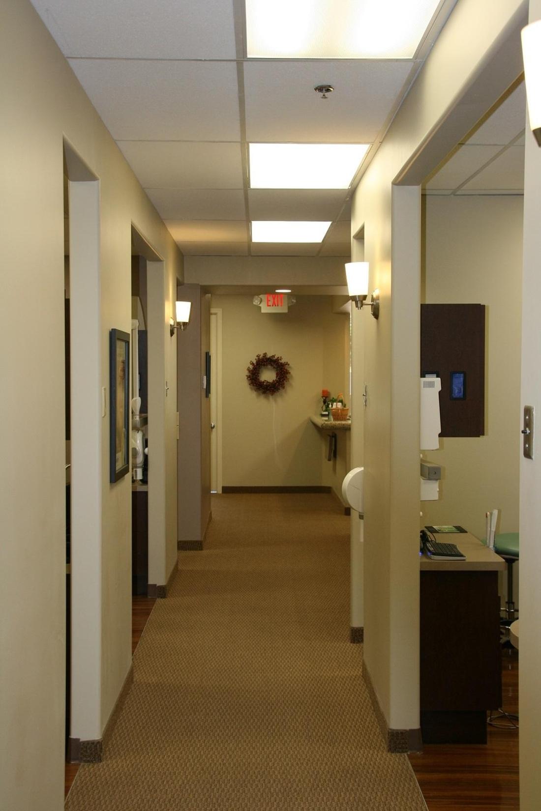 Our many treatment rooms dental hallway